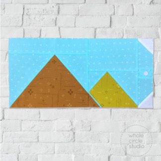 Great Pyramid of Giza in Cairo, Egypt quilt block made with Art Gallery Fabrics Elements / blenders. Foundation paper piecing quilt. Available at wholecirclestudio.com