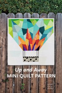 Make a Up and Away mini for your next quilt swap or as a gift. This 18″ x 18″ foundation paper pieced quilt is great as a wallhanging — add a border to make an oversized pillow or make multiple blocks and construct a larger quilt! This is the perfect pattern to use up your fabric scraps! If you need additional fabric to complement your stash, charm packs and fat eighths work well with this pattern. This tested pattern contains both detailed instructions and diagrams, making it easy to piece.