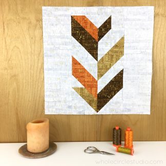 Leaf Peepers Quilt Pattern: Block 1. A modern, graphic spin on the traditional half square triangle. A great PDF pattern to use with solid fabric, prints or batiks!