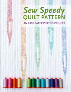 A great mini quilt to make as a wall hanging for your sewing space or gift to a sewist! Sew Speedy is a graphic modern quilt that uses foundation paper piecing techniques. Make additional blocks to make a larger quilt (layout ideas are provided). A pre-cut strip friendly pattern designed by Whole Circle Studio.