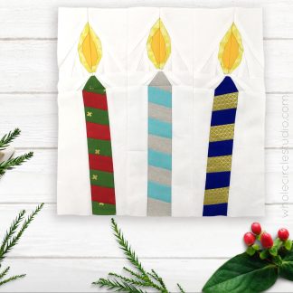 Let the festivities begin! Celebration Candles is an easy, quick block to make in an afternoon. This is the perfect quilt project to make for birthday or holiday celebrations. Included in this foundation paper piecing pattern are 3 designs (one candle leaning to left, one candle leaning to right, one candle upright). This is also a great pattern to use up your scraps! These blocks are the perfect size for a mini quilt, table quilt or pillow. Make multiple blocks to make a table runner or larger quilt. Designed by wholecirclestudio.com